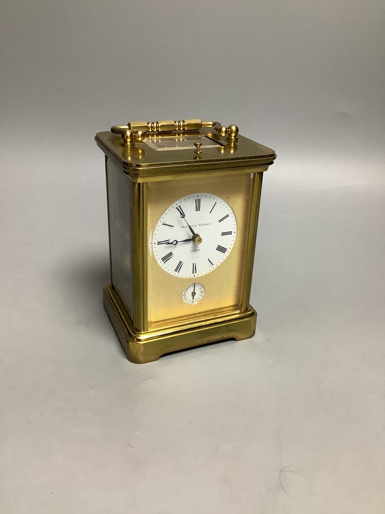 A Matthew Norman brass repeating carriage clock, serial number 1751, height 15cm